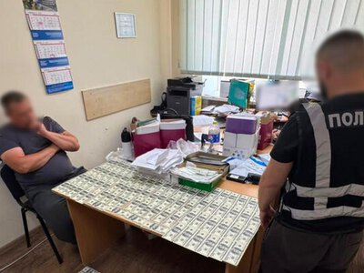 26 000 доларів за службу в тилу: у Києві поліцейські викрили корупційну схему